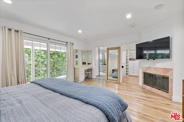 an aerial view of a house with a yard and trees