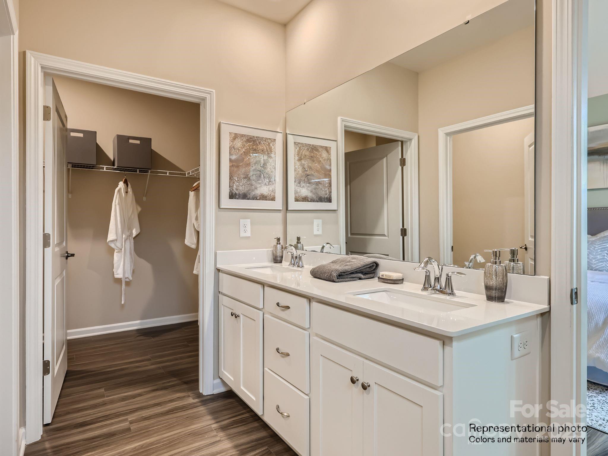 8494 Norman Frst Road Lancaster, SC 29720 - Photo 11 of 19 a bathroom with a double vanity sink and mirror