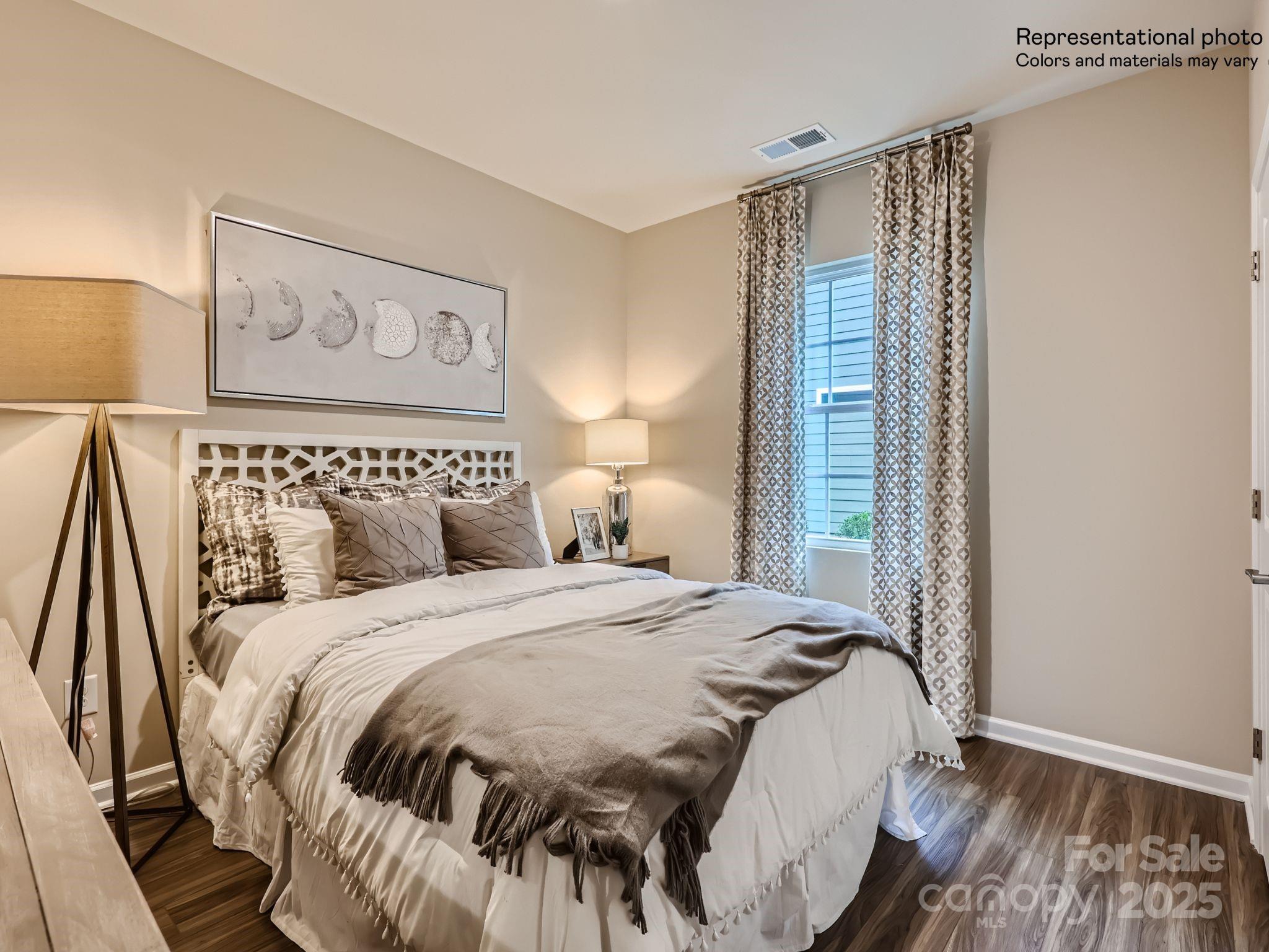 8494 Norman Frst Road Lancaster, SC 29720 - Photo 9 of 19 a bedroom with a bed and a painting on the wall