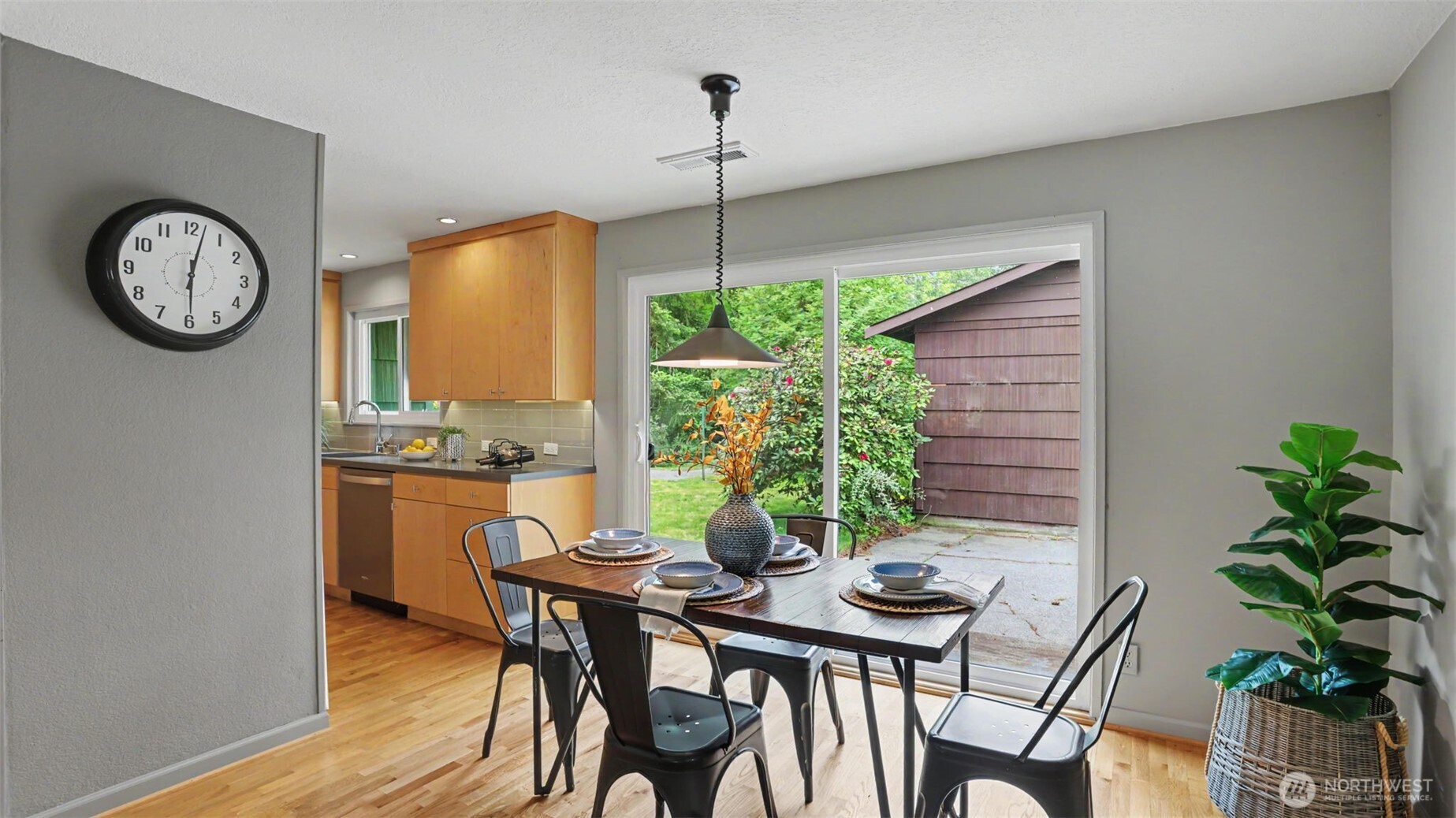 12515 Southeast 171st Street Renton, WA 98058 - Photo 12 of 24 a view of a dining room with furniture window and wooden floor