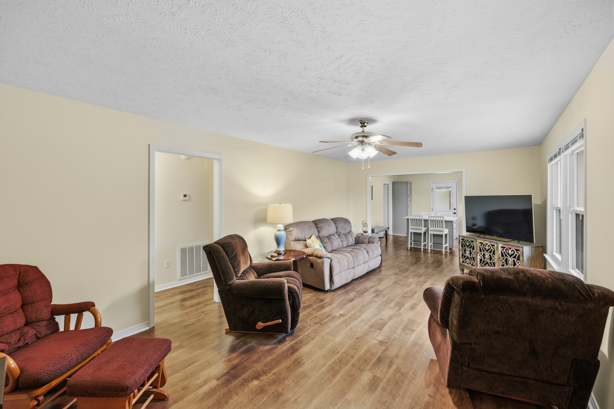 944 Brooksie Thompson Road Decaturville, TN 38329 - Photo 10 of 47 a living room with furniture and a flat screen tv
