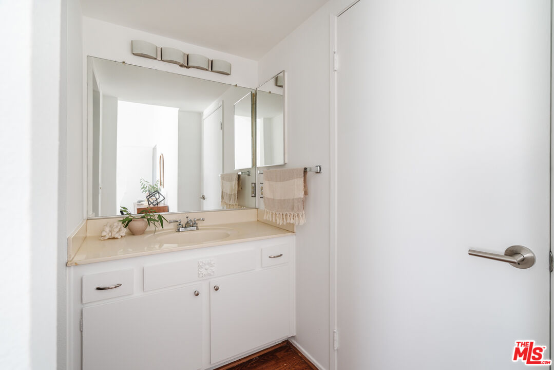 11106 Arminta Street, Unit 4 Sun Valley, CA 91352 - Photo 16 of 22 a bathroom with a sink and a mirror