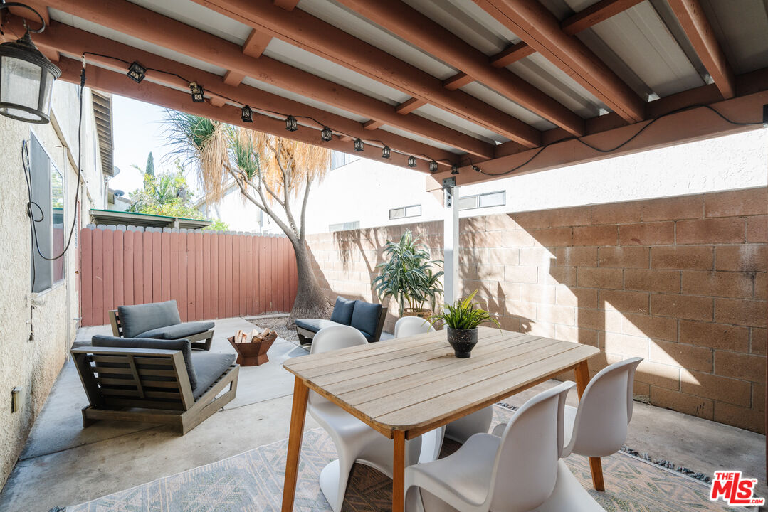 11106 Arminta Street, Unit 4 Sun Valley, CA 91352 - Photo 19 of 22 a outdoor dining space with furniture and outdoor view