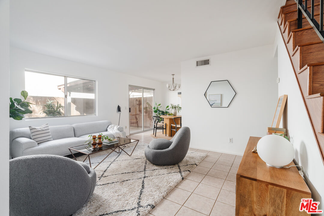 11106 Arminta Street, Unit 4 Sun Valley, CA 91352 - Photo 2 of 22 a living room with furniture and a large window