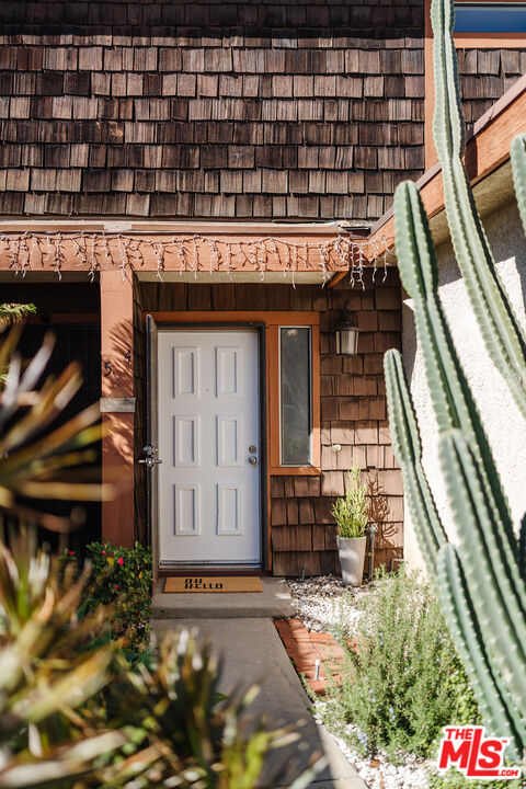 11106 Arminta Street, Unit 4 Sun Valley, CA 91352 - Photo 21 of 22 a front view of a building with entryway