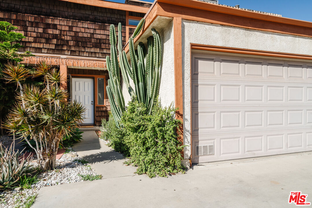 11106 Arminta Street, Unit 4 Sun Valley, CA 91352 - Photo 22 of 22 a front view of a house with a yard