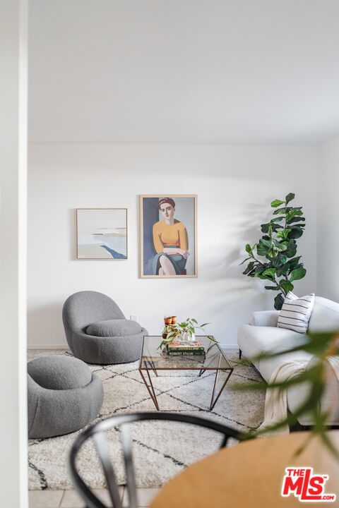 11106 Arminta Street, Unit 4 Sun Valley, CA 91352 - Photo 6 of 22 a living room with furniture and a potted plant