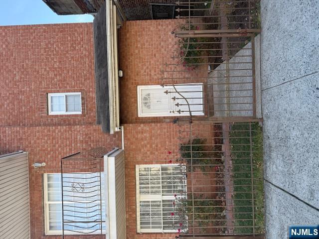 358 Hawthorne Avenue, Unit 356 Newark, NJ 07112 - Photo 1 of 8 a front view of a house with iron fence