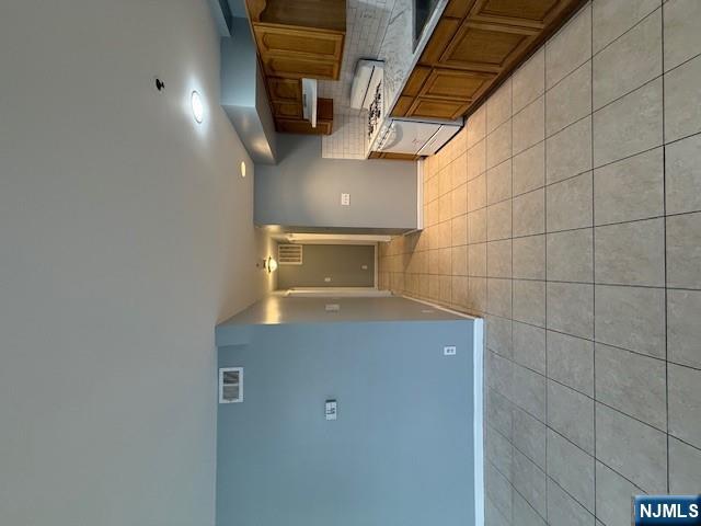 358 Hawthorne Avenue, Unit 356 Newark, NJ 07112 - Photo 4 of 8 a large kitchen with a stove a sink and a refrigerator