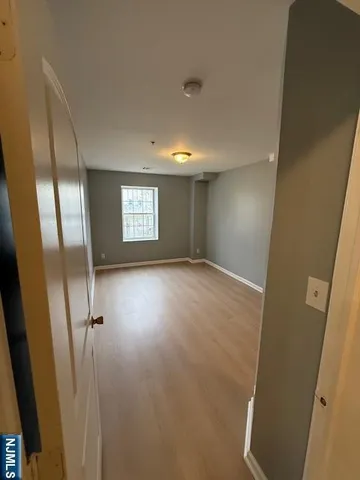 a view of an empty room and a window