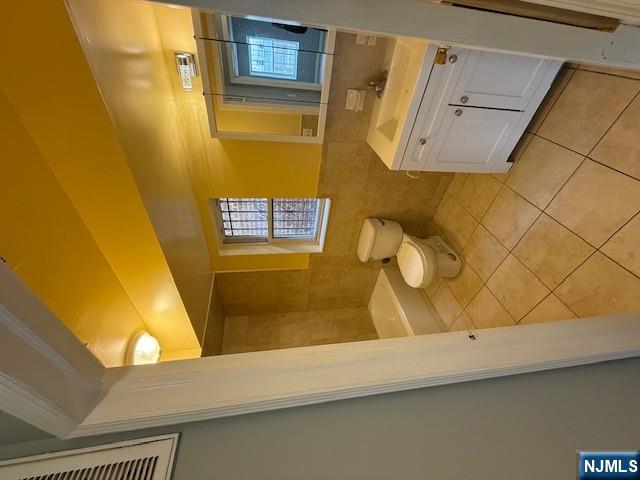 358 Hawthorne Avenue, Unit 356 Newark, NJ 07112 - Photo 8 of 8 a bathroom with a sink a toilet and a tub