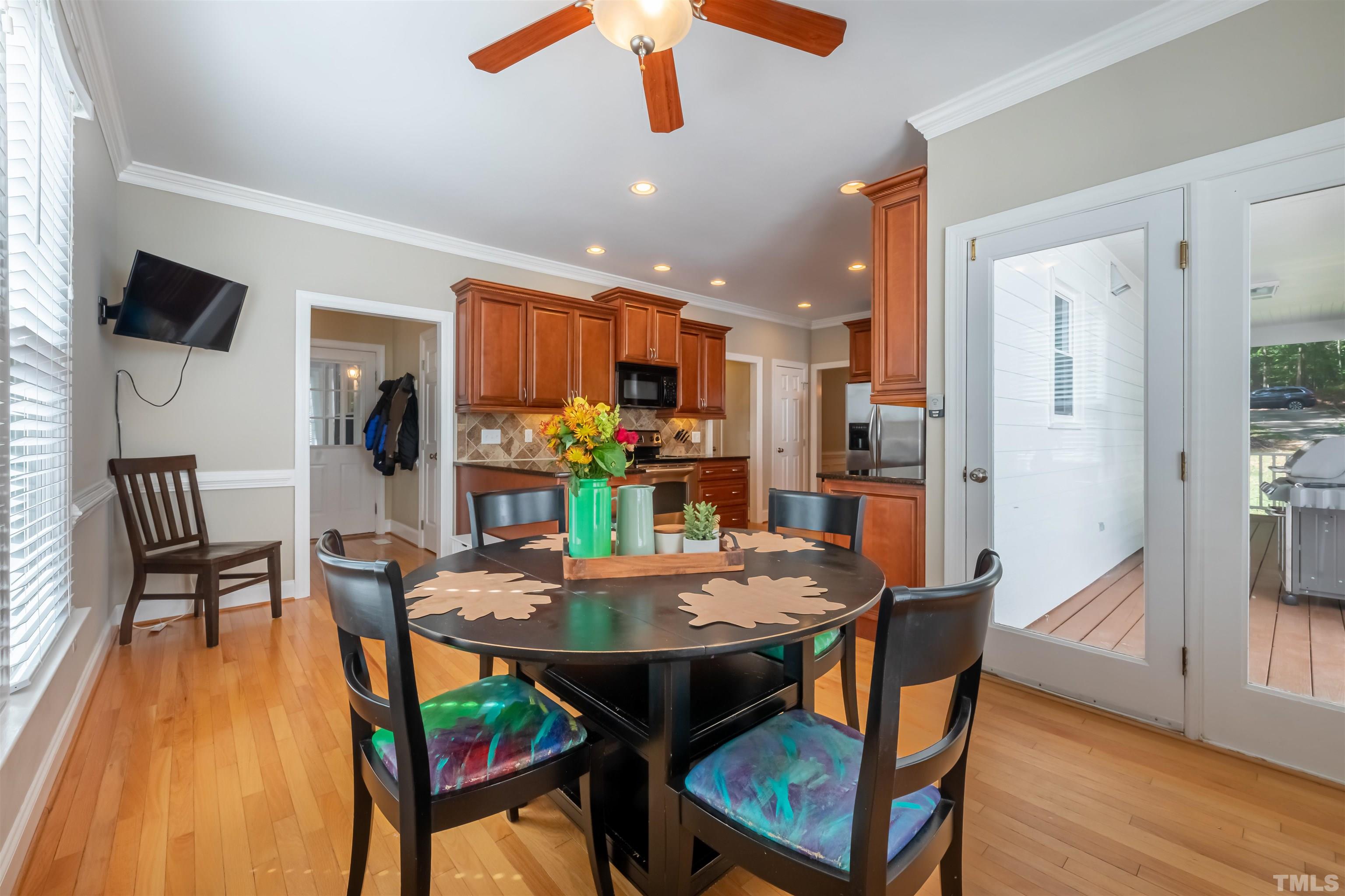 11308 Derby Lane Raleigh, NC 27613 - Photo 13 of 42 a view of a dining room with furniture and wooden floor