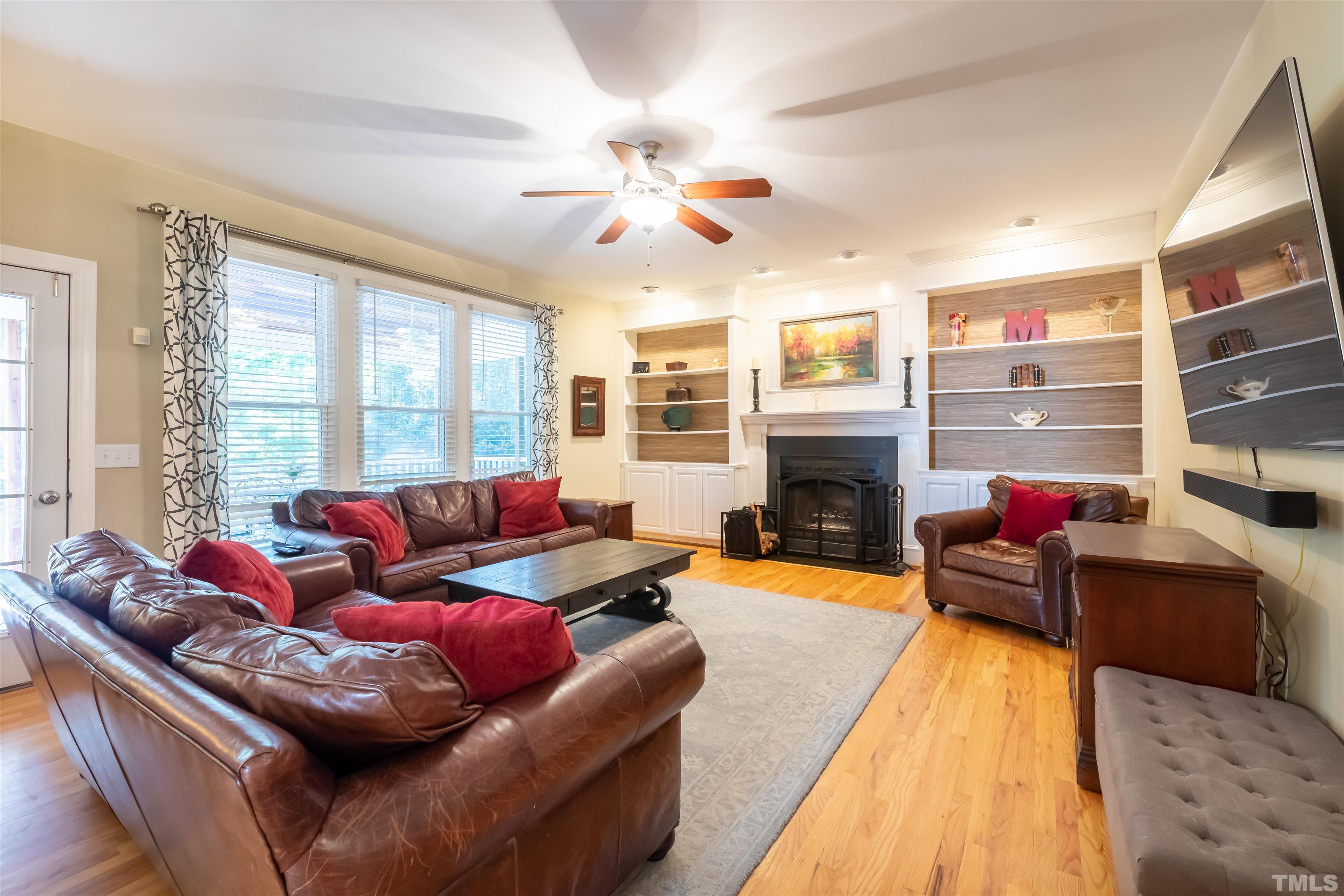 11308 Derby Lane Raleigh, NC 27613 - Photo 18 of 42 a living room with furniture window and a fireplace