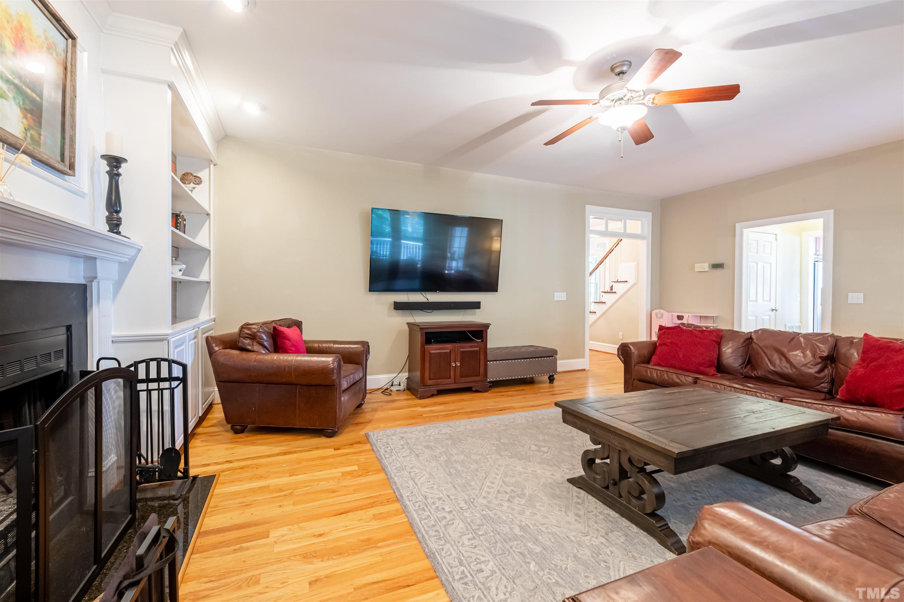 11308 Derby Lane Raleigh, NC 27613 - Photo 19 of 42 a living room with furniture and a flat screen tv