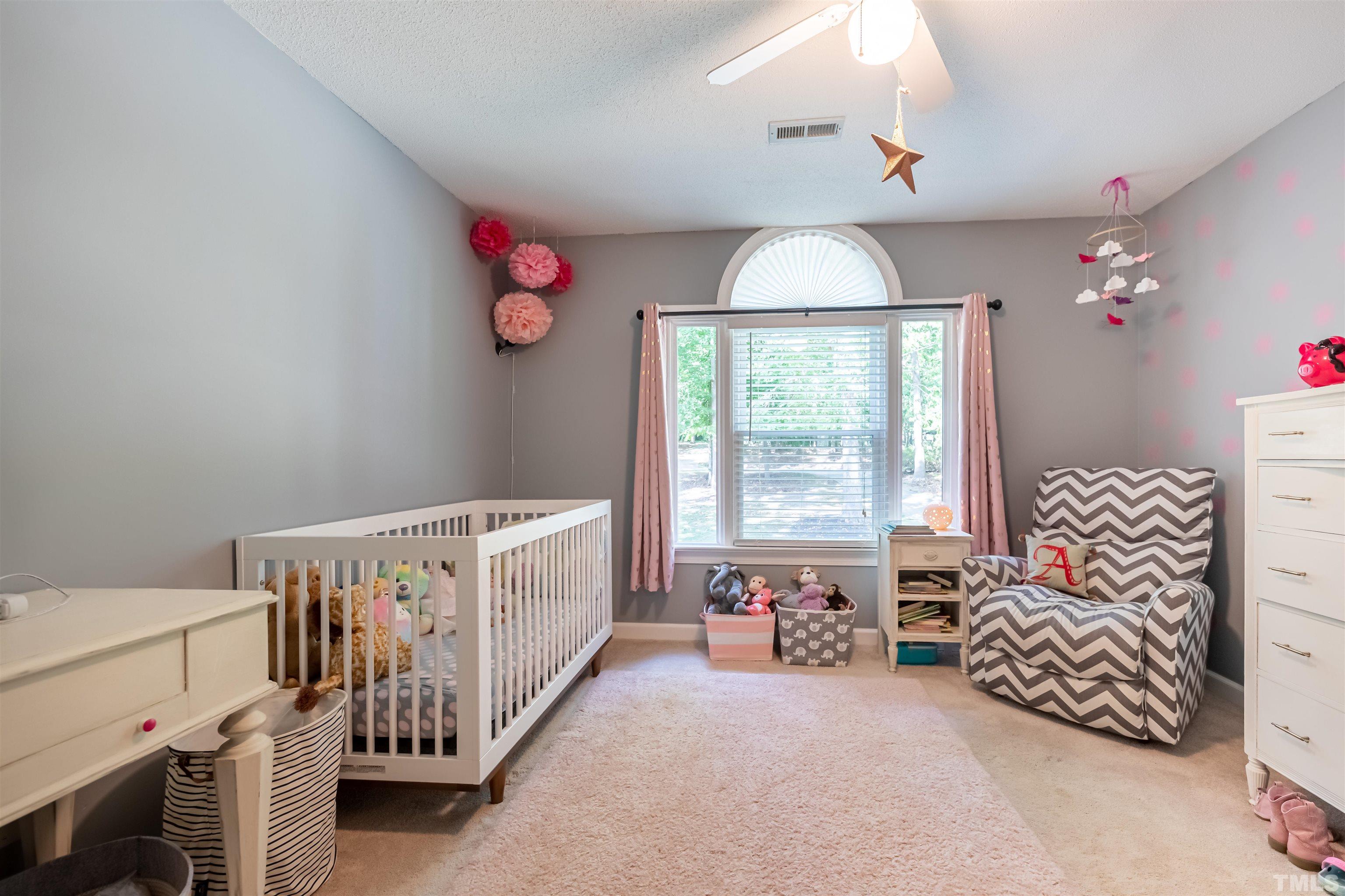 11308 Derby Lane Raleigh, NC 27613 - Photo 24 of 42 a bedroom with furniture and a window