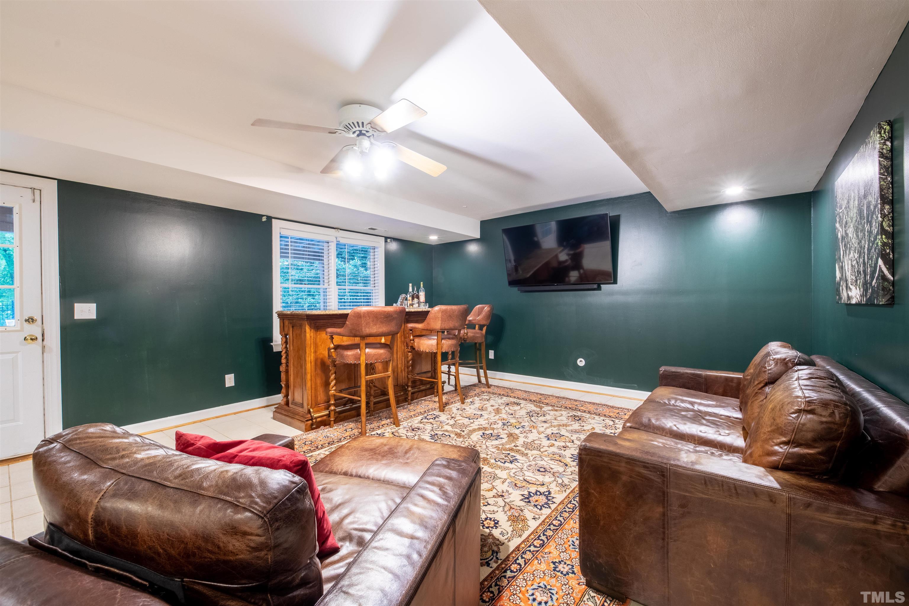11308 Derby Lane Raleigh, NC 27613 - Photo 29 of 42 a living room with furniture and a flat screen tv