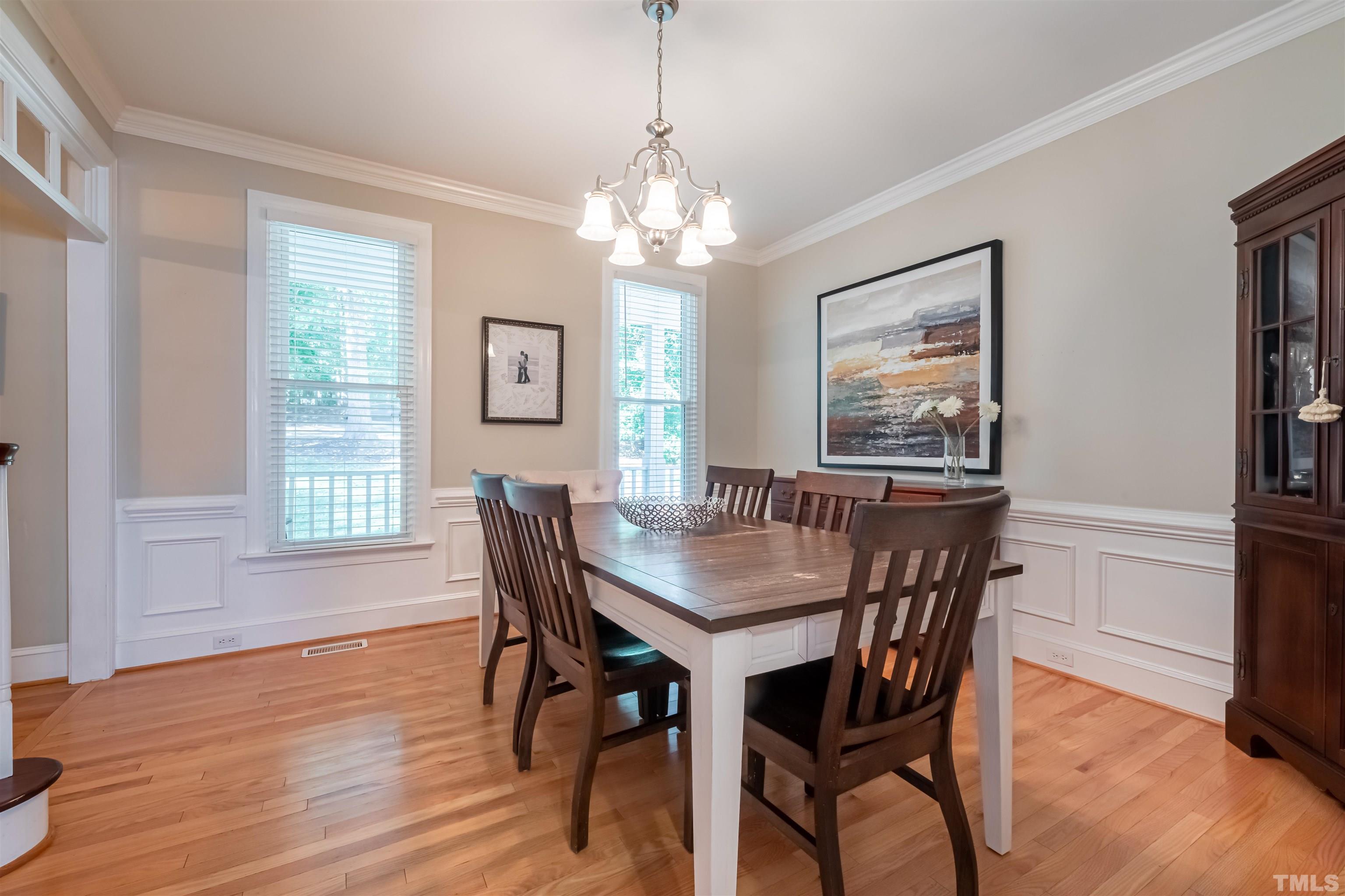 11308 Derby Lane Raleigh, NC 27613 - Photo 4 of 42 a view of a dining room with furniture window and wooden floor