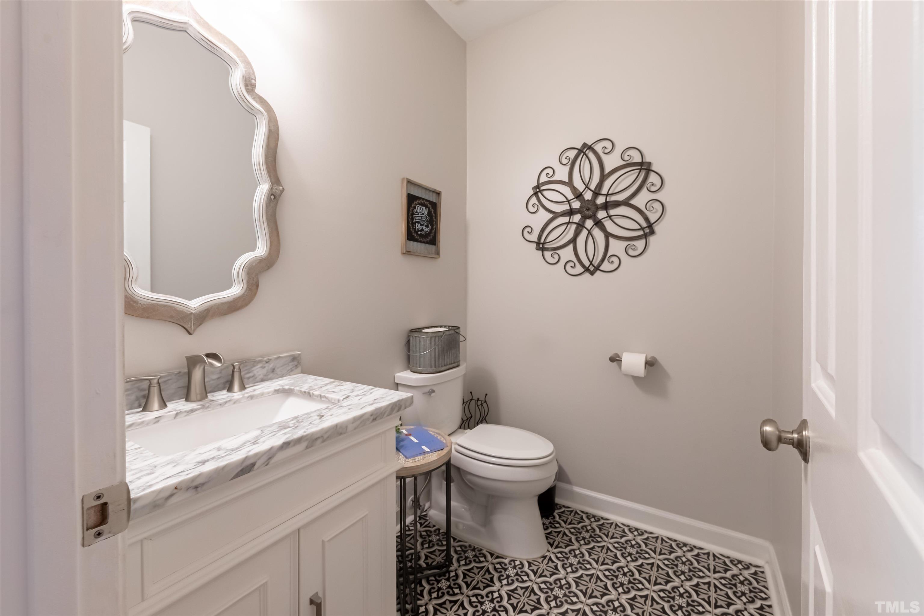11308 Derby Lane Raleigh, NC 27613 - Photo 7 of 42 a bathroom with a sink and a toilet