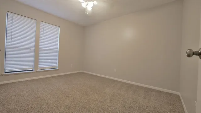 an empty room with a empty space and a window