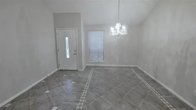 a view of a chandelier in an empty room