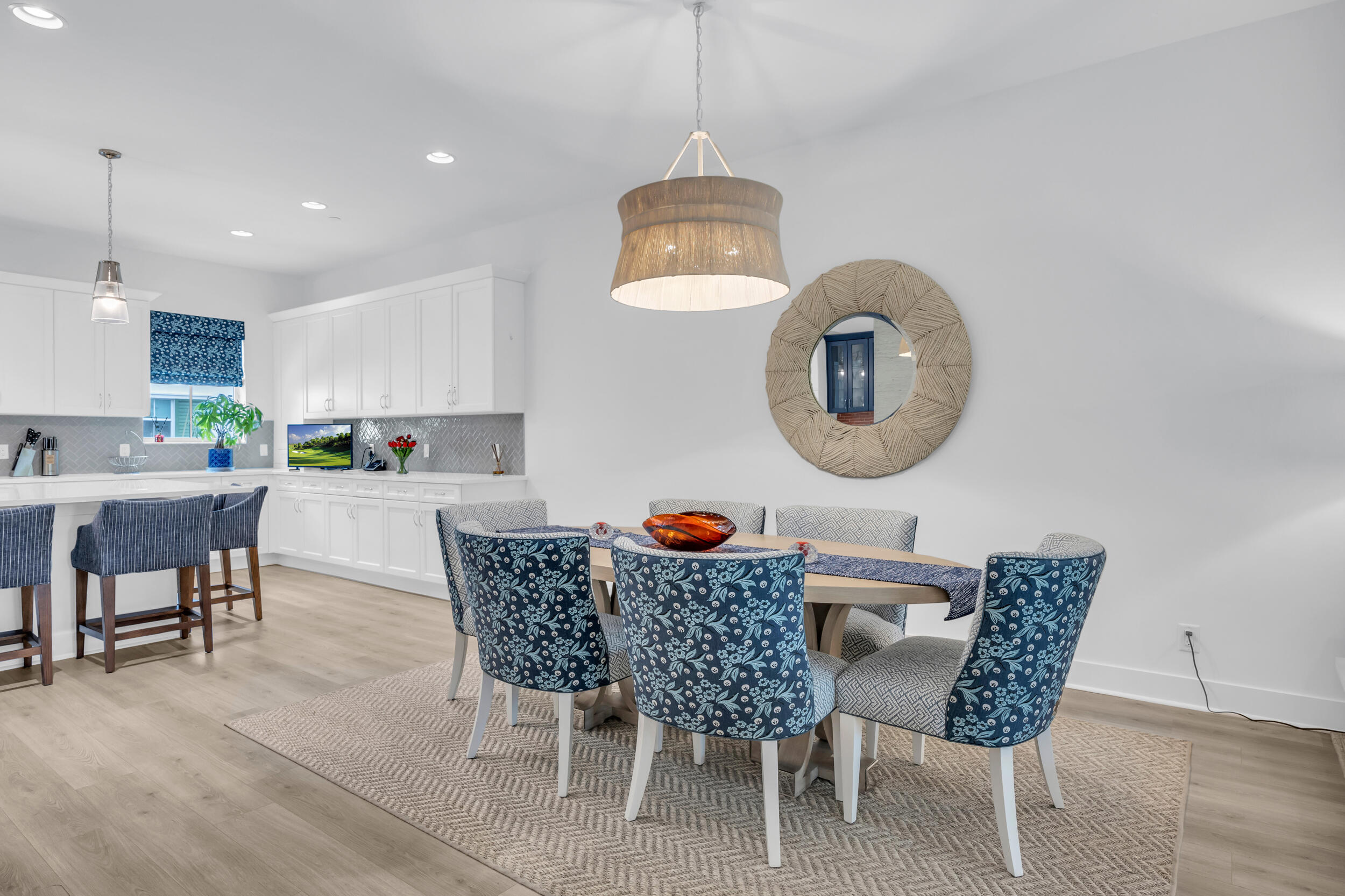 12554 Gross Pointe Road Palm Beach Gardens, FL 33418 - Photo 14 of 39 a dining room with furniture and mirror