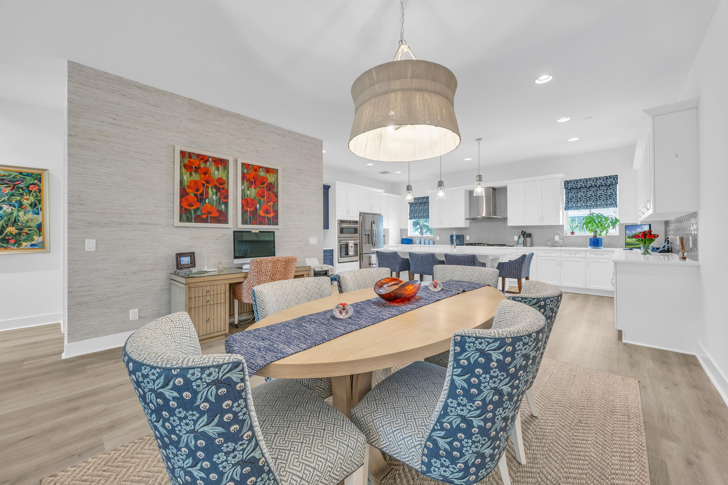12554 Gross Pointe Road Palm Beach Gardens, FL 33418 - Photo 15 of 39 a living room with fireplace furniture and a chandelier