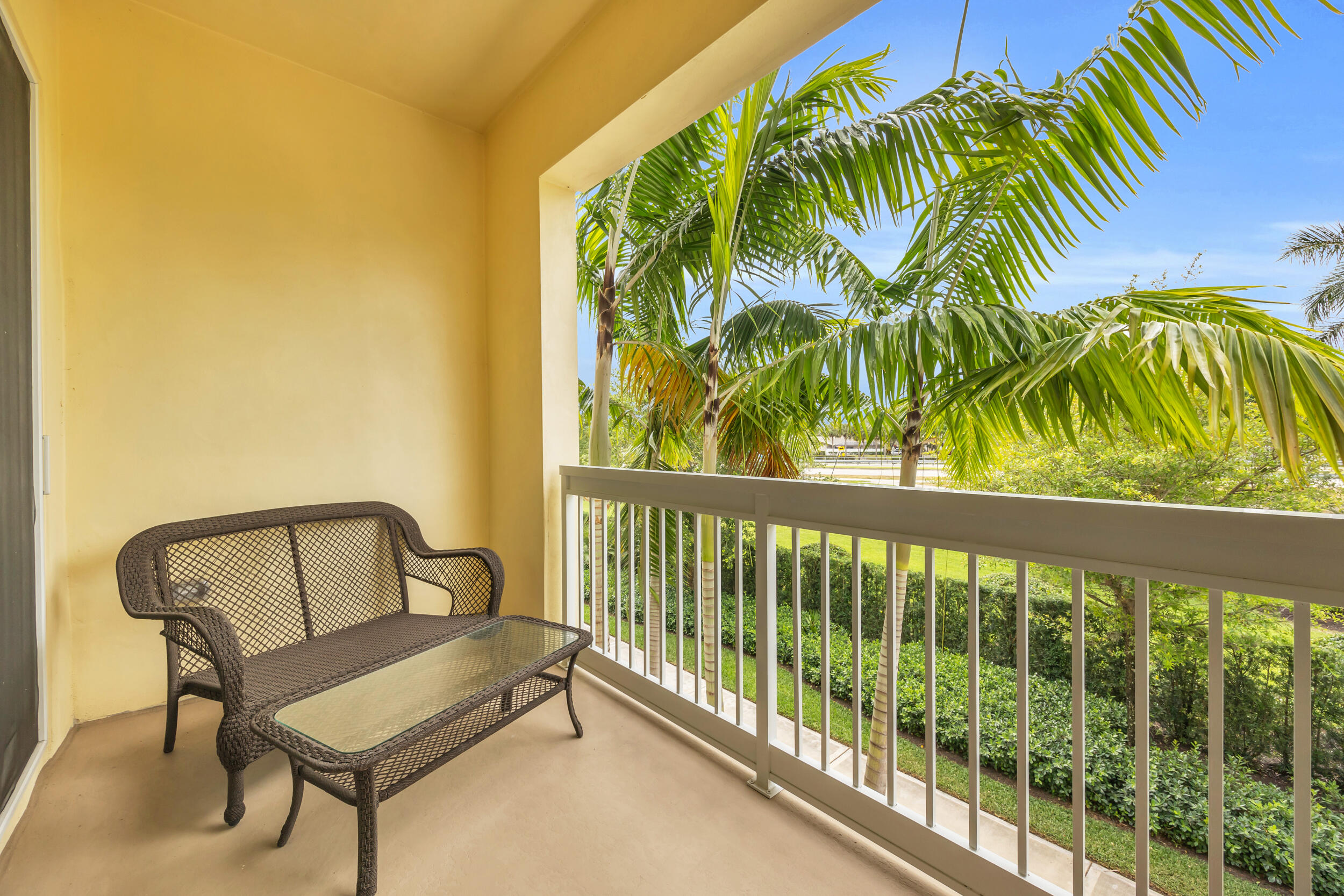 12554 Gross Pointe Road Palm Beach Gardens, FL 33418 - Photo 21 of 39 a view of a two chair in the balcony