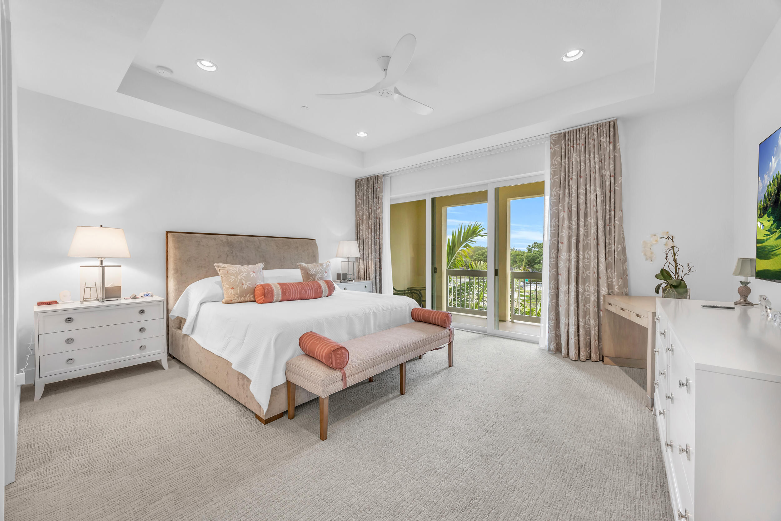 12554 Gross Pointe Road Palm Beach Gardens, FL 33418 - Photo 22 of 39 a spacious bedroom with a bed and a large window