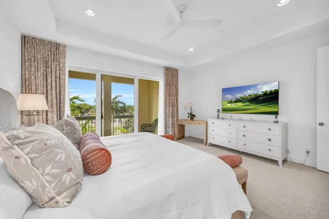 a bedroom with a bed and a night stand