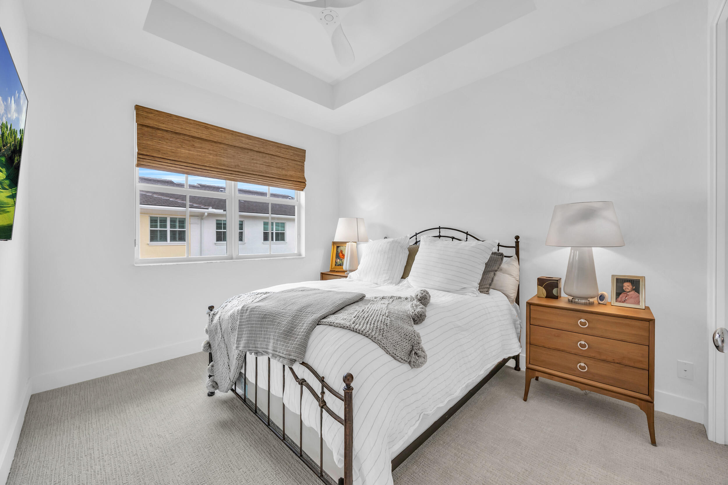 12554 Gross Pointe Road Palm Beach Gardens, FL 33418 - Photo 32 of 39 a bedroom with a bed and a window