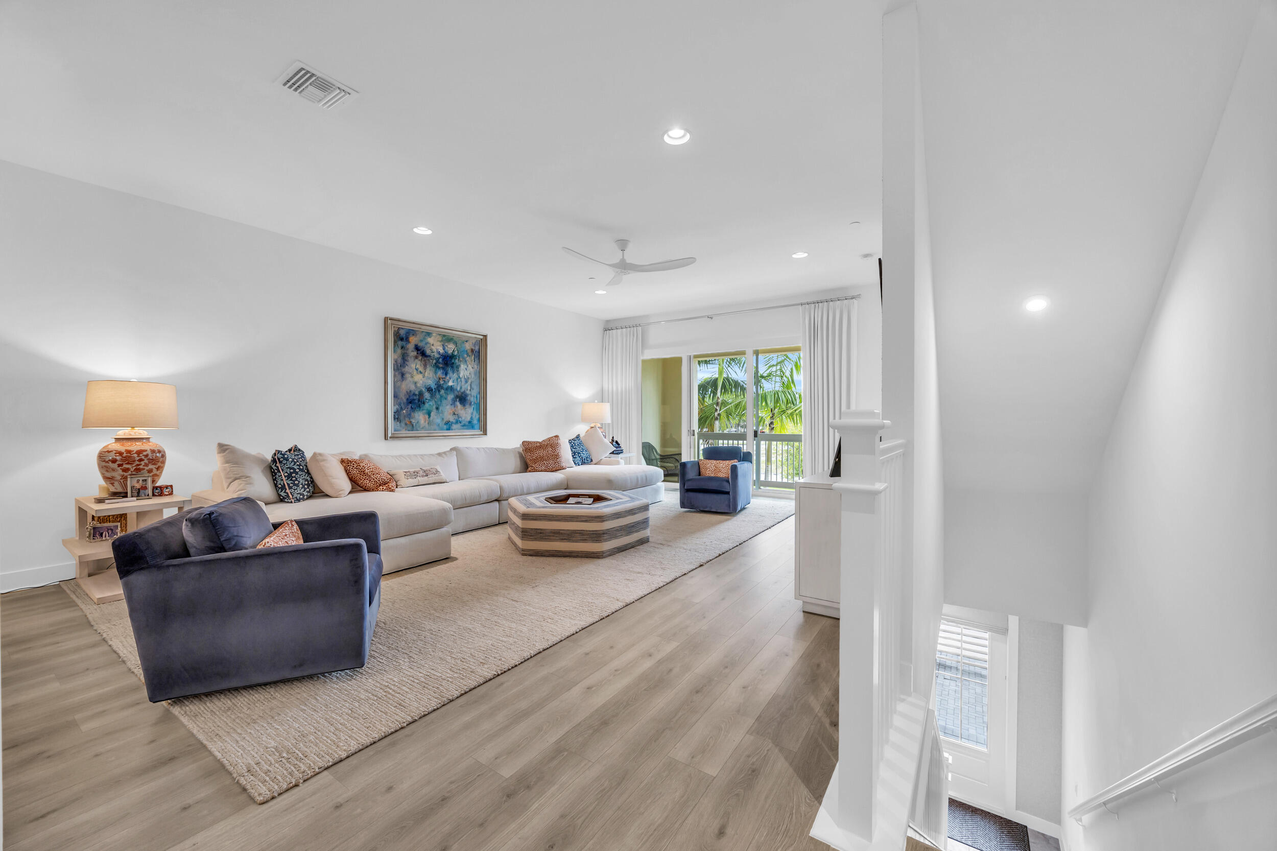 12554 Gross Pointe Road Palm Beach Gardens, FL 33418 - Photo 10 of 39 a living room with furniture and a wooden floor