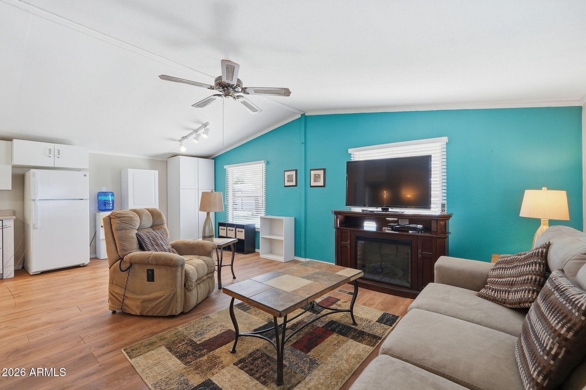 53 North Mountain Road, Unit 38 Apache Junction, AZ 85120 - Photo 5 of 35 a living room with furniture and a flat screen tv
