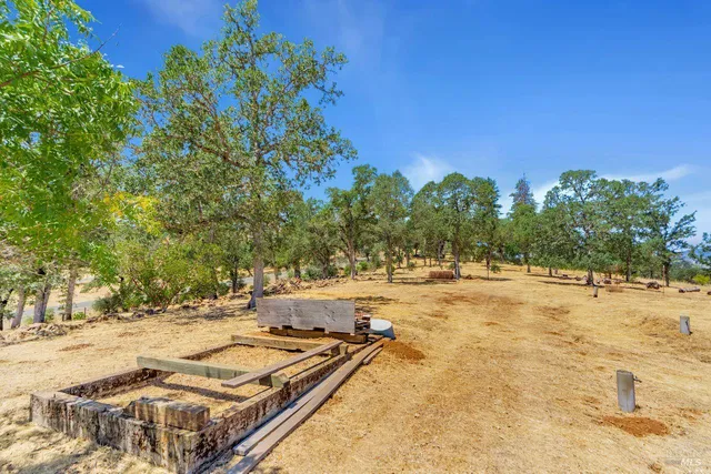 a view of a yard with swimming pool