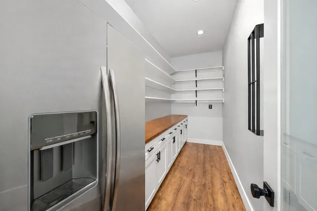 a utility room with cabinets washer and dryer