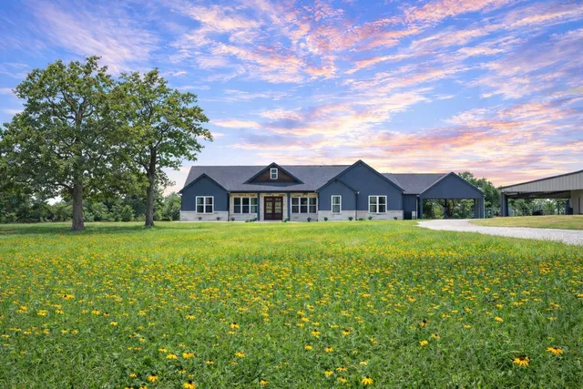 a view of a house with a big yard