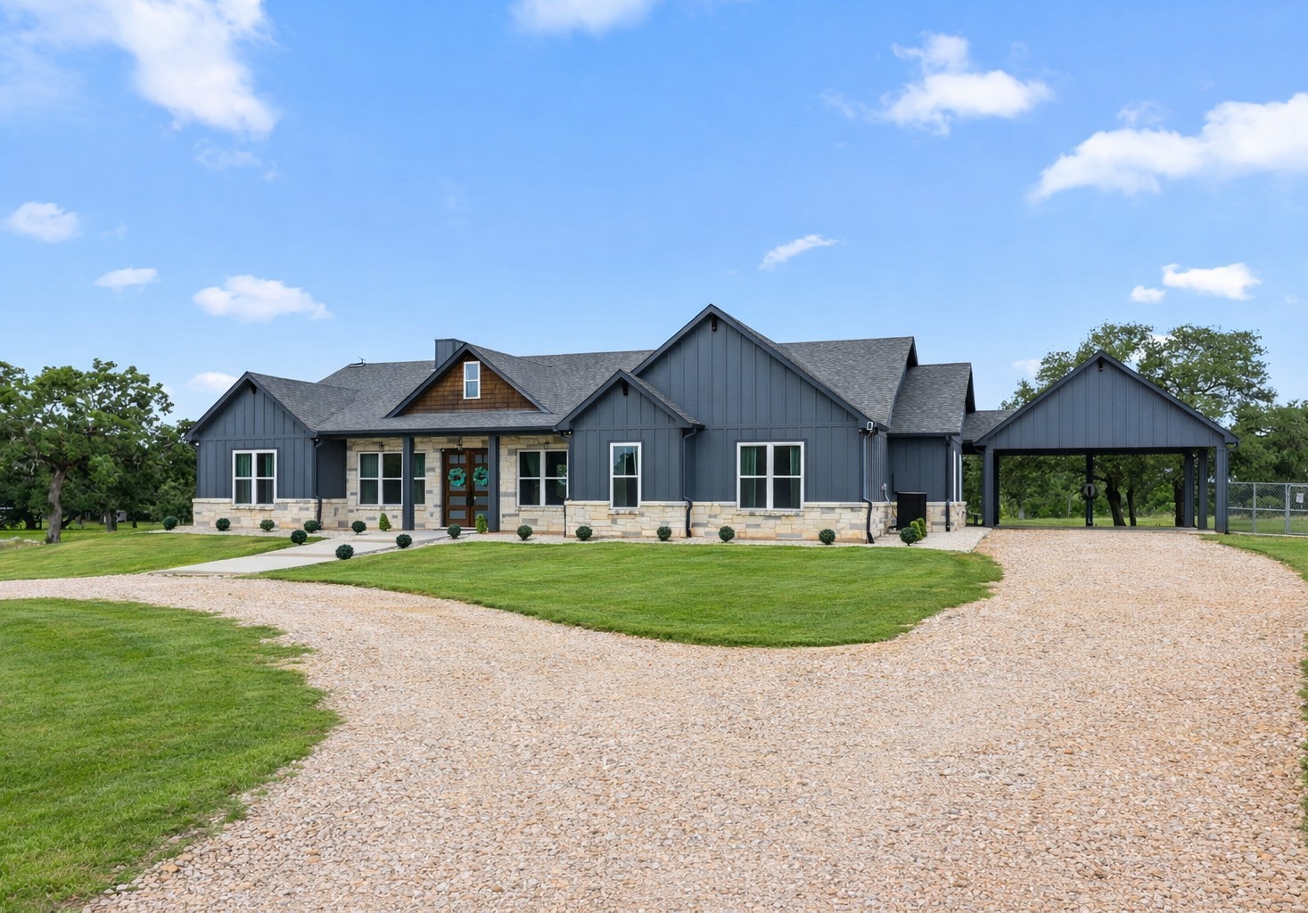 1507 Smith Rau Road Columbus, TX 78934 - Photo 37 of 42 a front view of a house with a yard and garage