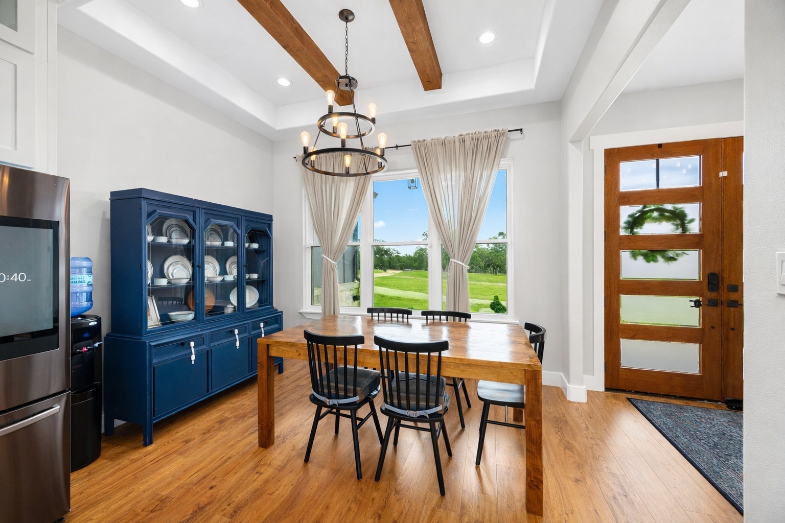 1507 Smith Rau Road Columbus, TX 78934 - Photo 6 of 42 a view of a dining room with furniture large window and wooden floor