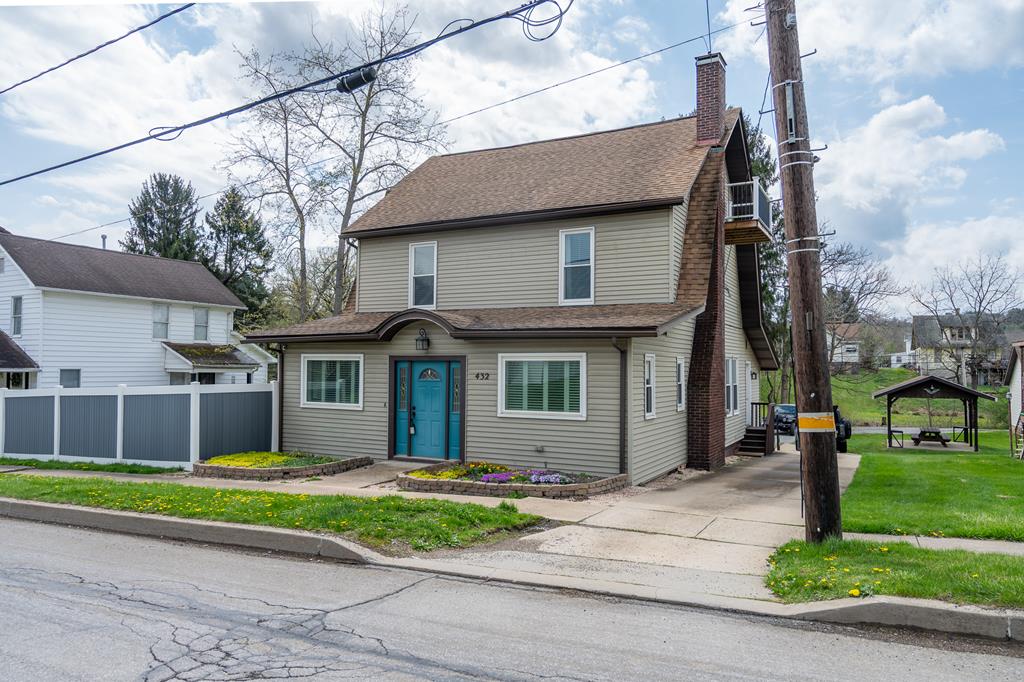 432 Colerain Street Sligo, PA 16255 - Photo 1 of 44 a front view of a house with a garden and plants