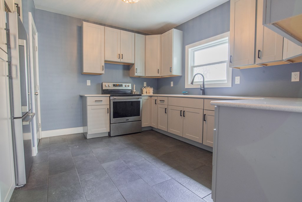 432 Colerain Street Sligo, PA 16255 - Photo 11 of 44 a kitchen with cabinets appliances and a window