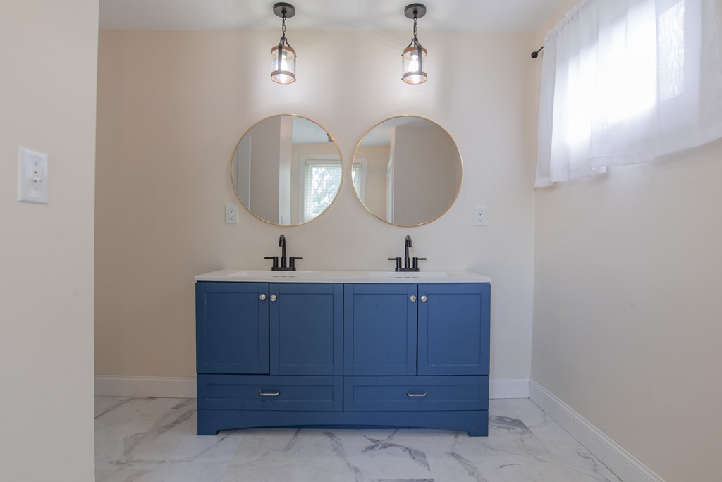 432 Colerain Street Sligo, PA 16255 - Photo 23 of 44 a bathroom with a double vanity sink and a mirror