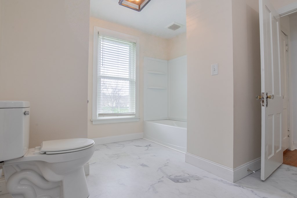 432 Colerain Street Sligo, PA 16255 - Photo 24 of 44 a bathroom with a toilet a sink and a shower