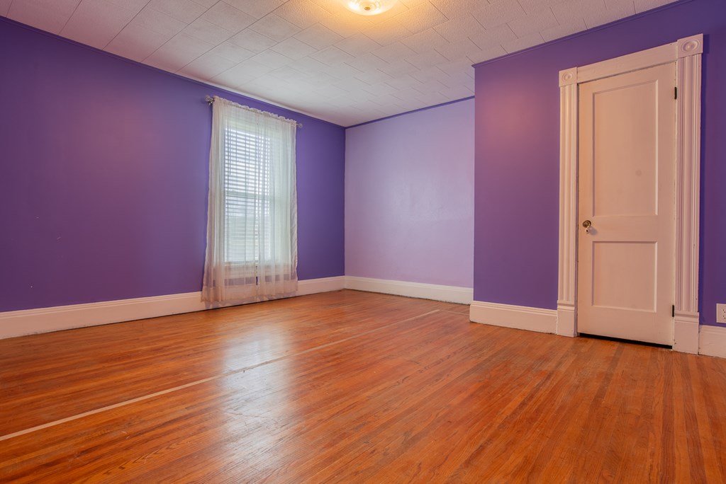 432 Colerain Street Sligo, PA 16255 - Photo 26 of 44 an empty room with wooden floor and windows