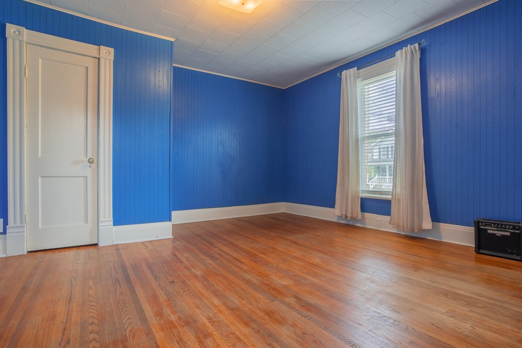 432 Colerain Street Sligo, PA 16255 - Photo 28 of 44 an empty room with wooden floor and windows