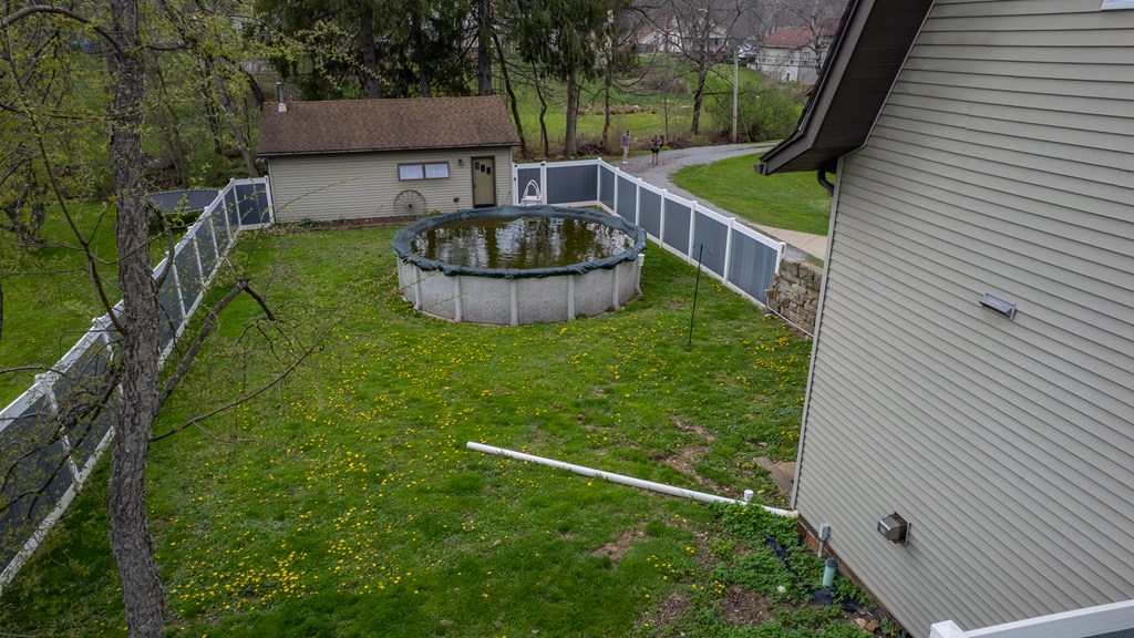 432 Colerain Street Sligo, PA 16255 - Photo 38 of 44 a backyard of a house with fountain table and chairs