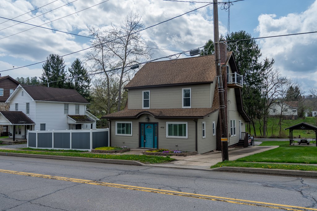 432 Colerain Street Sligo, PA 16255 - Photo 41 of 44 a view of a brick house with a clock tower in front of it