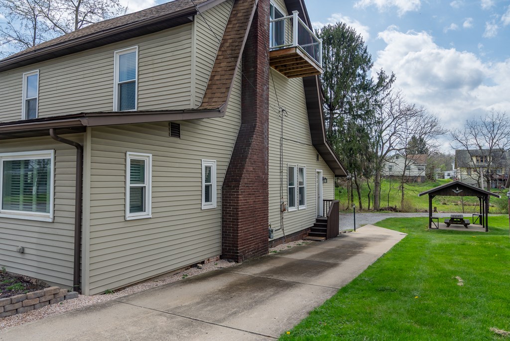 432 Colerain Street Sligo, PA 16255 - Photo 43 of 44 a view of a small house with a yard and wooden fence