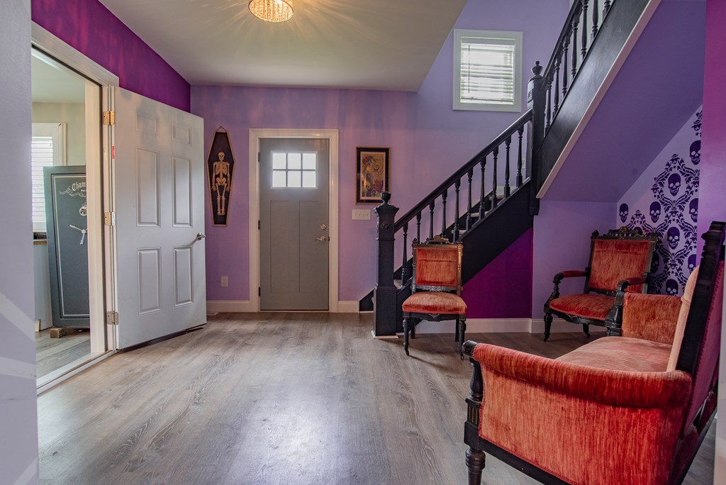 432 Colerain Street Sligo, PA 16255 - Photo 6 of 44 a view of an empty room with wooden floor and stairs