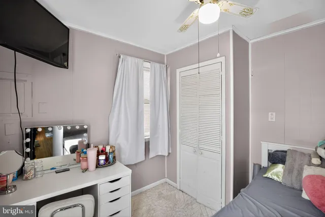 a room with a couch and a flat screen tv