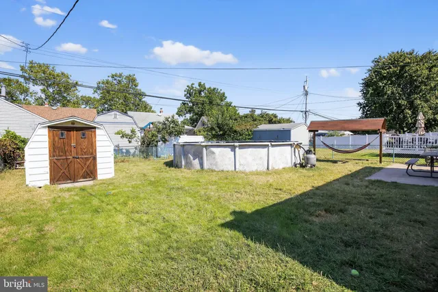 a view of a backyard with sitting area