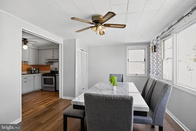 a dining room with furniture and window